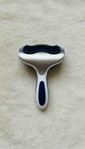 Ergonomic Pet Grooming Brush, front view on neutral background